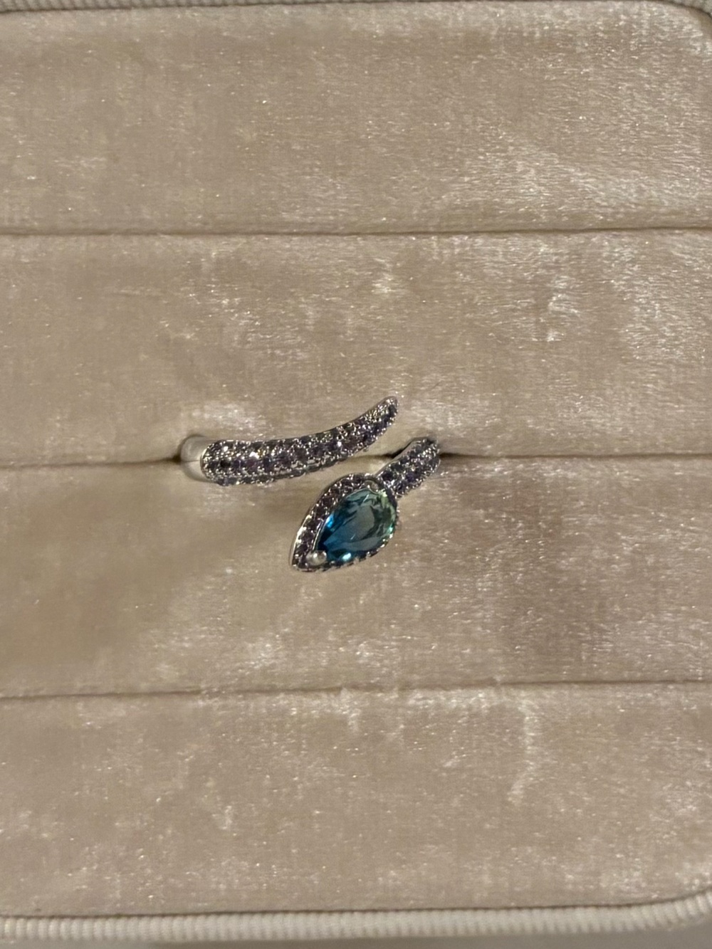 Rhodium Teardrop Blue Topaz Wrap Ring
